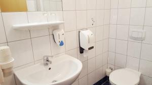Koupelna v ubytování G&K Hotel