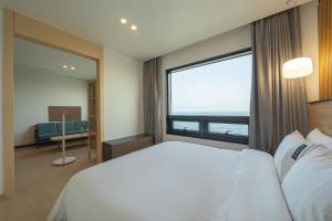 Postel nebo postele na pokoji v ubytování Hotel 701 Gyeongju