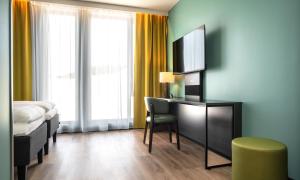 TV a/nebo společenská místnost v ubytování Thon Hotel Snø