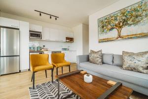 a living room with a couch and a table at 301 Le Jardin in George