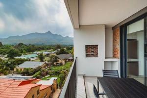 a balcony with a view of the mountains at 301 Le Jardin in George