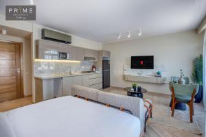 a bedroom with a bed and a living room at Prime Residence Kattameya in Cairo
