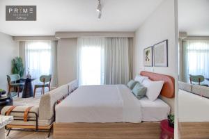 a bedroom with a bed and a living room at Prime Residence Kattameya in Cairo