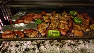 a bunch of different types of food in an oven at Hostel Porto Vip in Porto De Galinhas