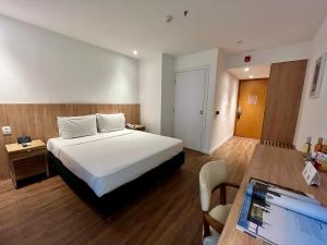 Cama ou camas em um quarto em Pestana Rio Atlantica