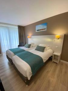 Postel nebo postele na pokoji v ubytování Best Western Plus Hôtel la Rade