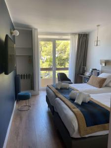 Postel nebo postele na pokoji v ubytování Best Western Plus Hôtel la Rade