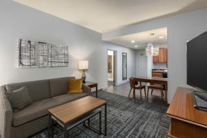 a living room with a couch and a table at Homewood Suites by Hilton Phoenix North-Happy Valley in Phoenix