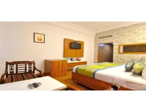 מיטה או מיטות בחדר ב-Hotel Solitaire, Chandigarh