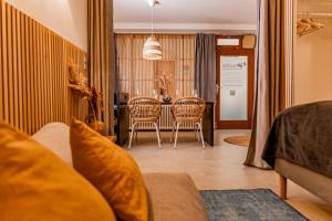 a living room with a table and two chairs at Suite-Regensburg in Regensburg