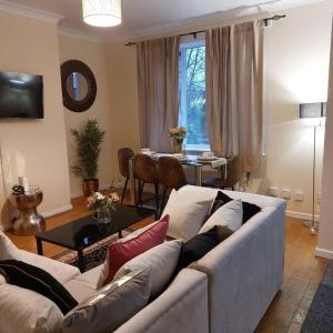 a living room with a couch and a table at 3-Bed House in Warrington in Warrington