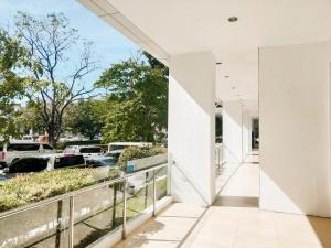 a view of a parking lot from the balcony of a house at Studio with mountain view, near Limketkai mall in Prime Cagayan de Oro in Cagayan de Oro