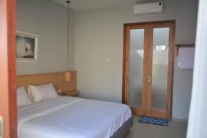 Postel nebo postele na pokoji v ubytování THe Kind Homestay