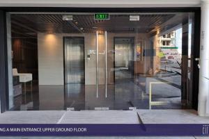 an entrance to a building with a glass door at Amani Grand Luxury Big Suite/Near Airport/3beds in Davao City