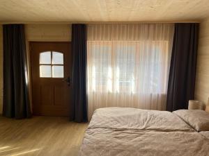 A bed or beds in a room at New Studio in Chalet Kuckuk