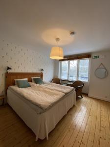 Säng eller sängar i ett rum på Minnesberg Bed & Breakfast