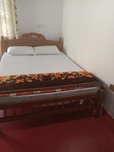 Postel nebo postele na pokoji v ubytování Madan Homestay