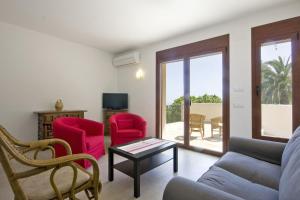 a living room with a couch and two chairs and a table at Villa Lia - PlusHolidays in Calpe
