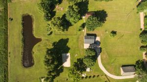 an overhead view of a yard with a house and trees at Holiday home Uzbazes in Valmiera