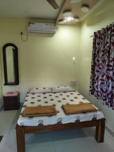 Letto o letti in una camera di Konkan Villa Dream