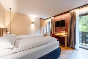 Postel nebo postele na pokoji v ubytování Hotel Vioz