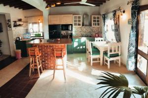 a kitchen with a table and chairs and a dining room at Shanti Garden House in Dahab