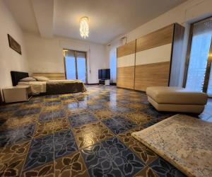 a large room with a bed and a couch at La Famosa Dimora Ambasciatore in San Marino