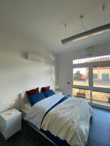 a bedroom with a large bed and a window at *Love'n fly apartament * Airport- Ducati in Bologna