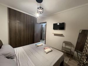 Postel nebo postele na pokoji v ubytování Όμορφο διαμέρισμα στην Παραλία