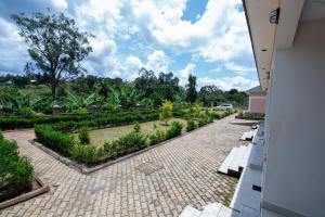 a view of a garden from the balcony of a building at Katente Country Resort in Kyegegwa