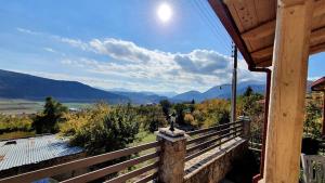 a porch of a house with a view of the mountains at Angelic in the mountains in Kaisárion