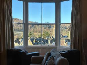a living room with a large window looking out at a town at 4 Studio House in Ambleside