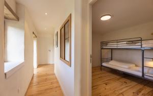 a hallway with bunk beds in a room at Maison pour 4 personnes proche de La Torche in Plomeur