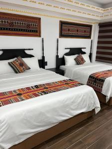 Postel nebo postele na pokoji v ubytování Trung Huyền Hotel