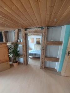a room with a bed and a wooden ceiling at 4 Zimmer Wohnung in Albstadt