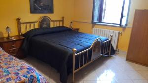 Posteľ alebo postele v izbe v ubytovaní Appartamento con giardino e parcheggio riservato