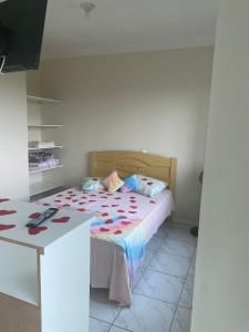 En eller flere senge i et værelse på Pousada dos Reis