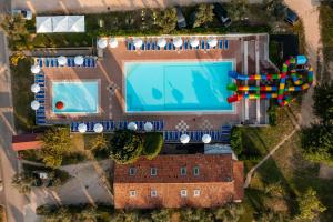 an overhead view of a swimming pool in a resort at Camping Fontanelle in Moniga +32 photos