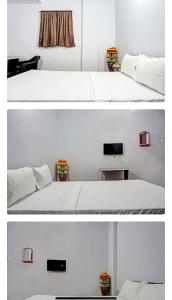 Ένα ή περισσότερα κρεβάτια σε δωμάτιο στο Lotus Guest House