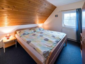 Postel nebo postele na pokoji v ubytování Holiday Home Holiday Hill 46 by Interhome