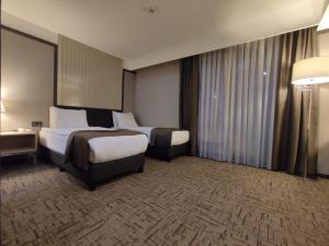 Postelja oz. postelje v sobi nastanitve Invite Hotel Corner Trabzon