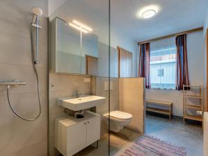 a bathroom with a sink and a toilet and a shower at Holiday Home Pilz II - SLD510 by Interhome in Rohrmoos