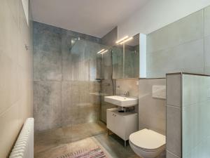 a bathroom with a toilet and a sink and a shower at Holiday Home Pilz II - SLD510 by Interhome in Rohrmoos