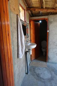 a bathroom with a sink and a toilet at Sahara Berber Camp - Mhamid Discovery Camp in Mhamid el Rhozlane