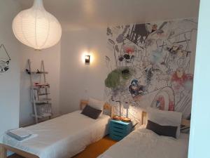 En eller flere senge i et værelse på Villa au calme avec grande piscine