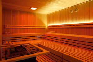 an empty sauna with wood paneled walls at Romantik Hotel Kieler Kaufmann in Kiel