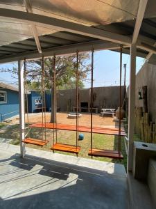 a screened in porch with a ping pong court at Nambani House in Windhoek