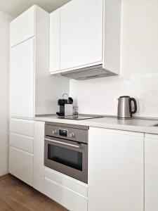 Η κουζίνα ή μικρή κουζίνα στο Magnolia: Moderne, voll möblierte Wohnung +2 φωτογραφίες