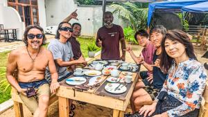 a group of people sitting around a table eating food at La Polena in Matara +79 photos