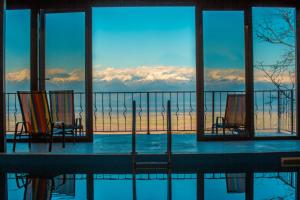 a view of the mountains from a swimming pool at Villaggio Mirzaani Resort in Sighnaghi